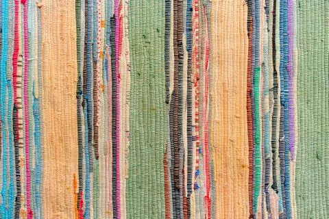 Multi-colored hand-made carpet from fabric. Stock Photos