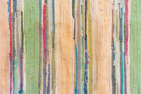 Multi-colored hand-made carpet from fabric. Stock Photos