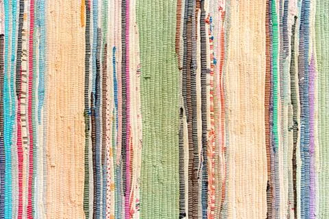Multi-colored hand-made carpet from fabric. Stock Photos