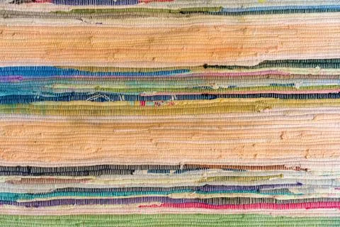 Multi-colored hand-made carpet from fabric. Stock Photos