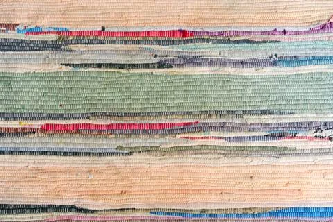 Multi-colored hand-made carpet from fabric. Stock Photos