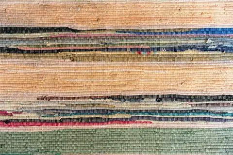 Multi-colored hand-made carpet from fabric. Stock Photos