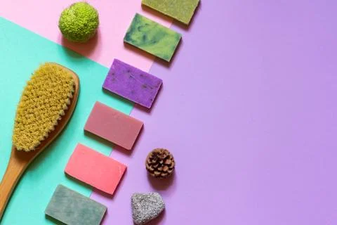 Multi-colored handmade soap made from natural ingredients on a colored Stock Photos