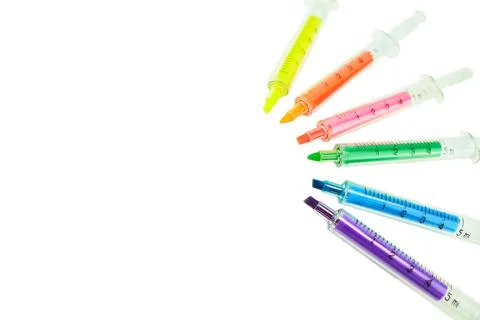 Multi Colored highlighters in the form of a syringe. Stock Photos