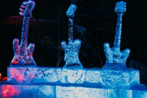 Multi-colored ice guitars at winter memorial installation Stock Photos