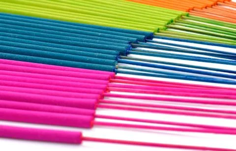 Multi-colored incense isolated on white background Stock Photos