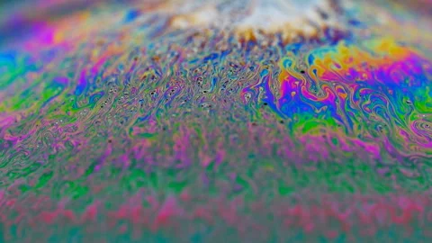 Multi-colored iris of a soap bubble in motion Stock Footage 100601557
