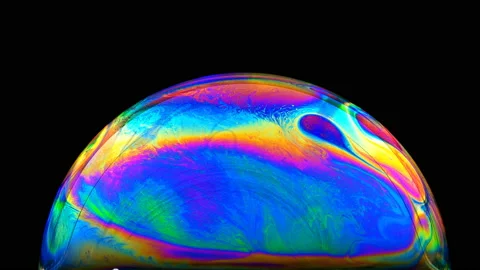 Multi-colored iris of a soap bubble in motion Stock Footage 100692363