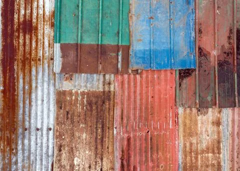 Multi-colored iron sheets, corrugated sheets of old roofing material, color.. Stock Photos