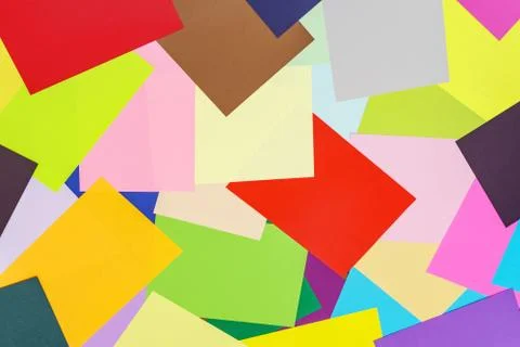 A multi-colored kaleidoscope of colored sheets of paper scattered chaotically in Stock Photos