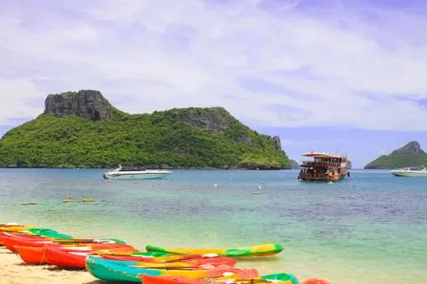 Multi-colored kayaks on the ocean. active travel vacation Stock Photos