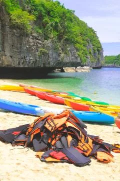 Multi-colored kayaks on the ocean. active travel vacation Stock Photos