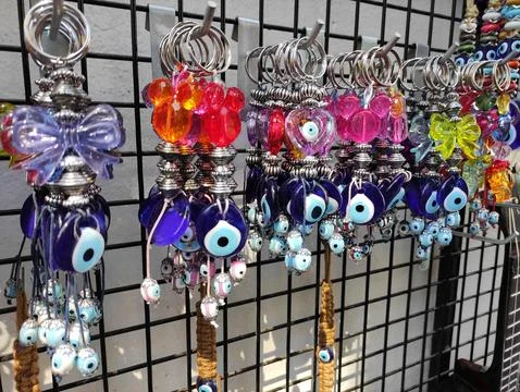 Multi-colored key rings with hanging plastic decorations Stock Photos