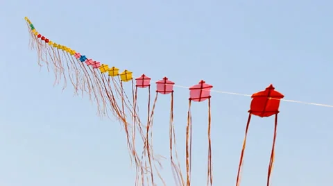 Multi-colored kites soaring arranged in a line. Up to the sky Stock Footage 37448396