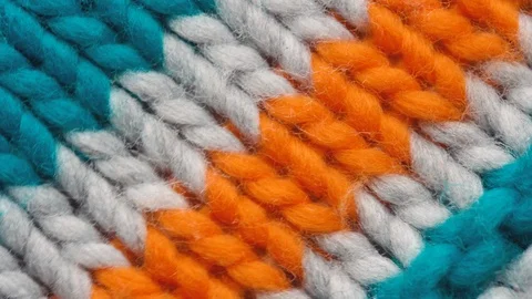 Multi-colored knitted fabric threads macro Stock Footage 125948852