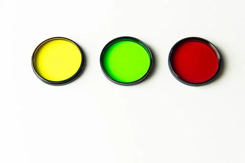 Multi-colored light filters on a white background. Stock Photos
