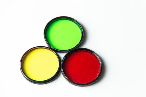 Multi-colored light filters on a white background. Stock Photos