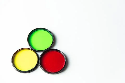 Multi-colored light filters on a white background. Stock Photos