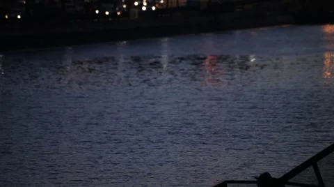 Multi Colored Light Flashes over Water Ripples Sunset Stock Footage 47479987