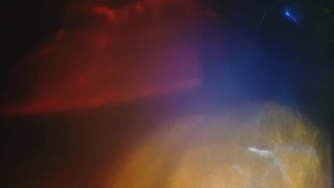 Multi-colored light passes through piece of glass. Unique creative light leaks. Video stock 120483534