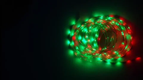 Multi-colored light system, garland, LED lamp on a dark background Stock Photos