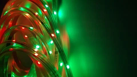 Multi-colored light system, garland, LED lamp on a dark background Stock Photos