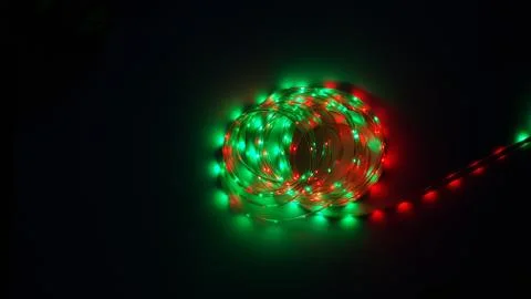 Multi-colored light system, garland, LED lamp on a dark background Stock Photos