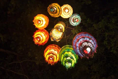 Multi-colored lights adorn the night beach of Ao Nang Stock Photos