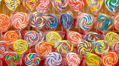 Multi-colored lollipops looping seamless video Stock Footage 125520814