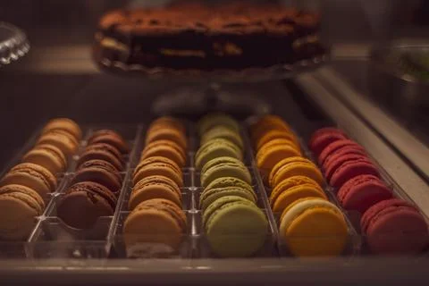 Multi-colored macaroons red, yellow, blue, green, orange colors on the counter Stock Photos