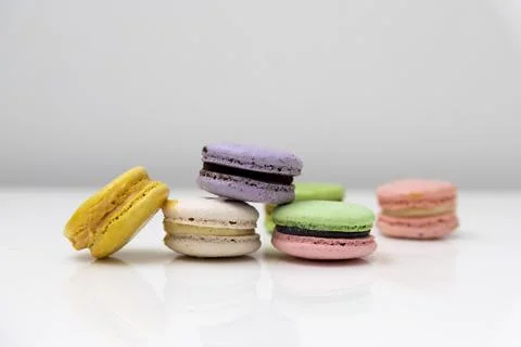 Multi colored macaroons in a white table perfect for a gift Stock Photos