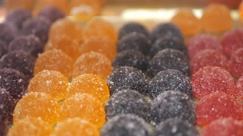 Multi-colored marmalade in a shop window Stock Footage 292491090