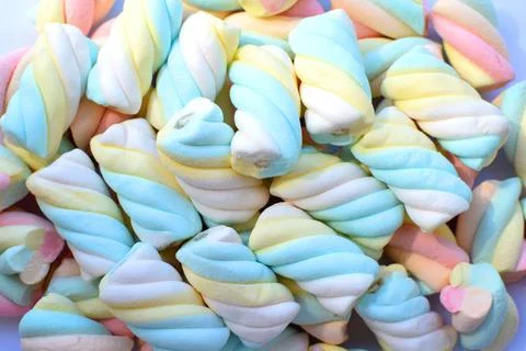 Multi-colored marshmallows. Top view. Background or texture of colorful blue Stock Photos