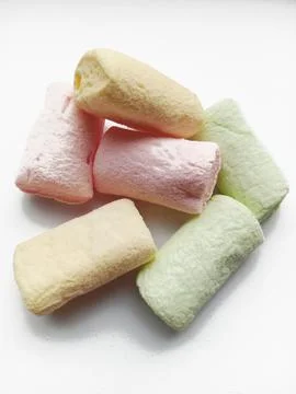 Multi-colored marshmallows on a white background Stock Photos