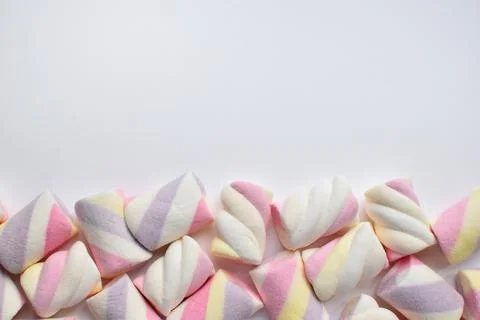 Multi-colored marshmallows on white background. Background or texture of co.. Stock Photos