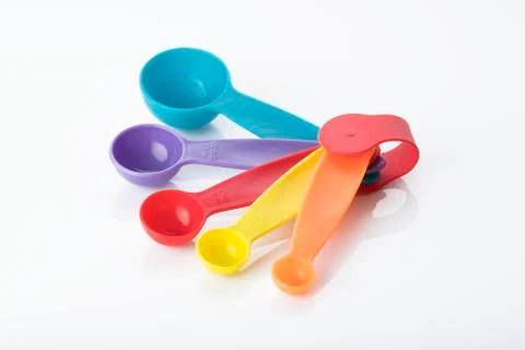 Multi Colored Measuring Spoons Isolated on White Background Stock Photos