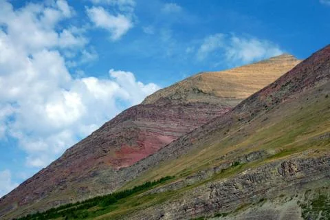 Multi-colored Mountain with White Clouds Stock Photos