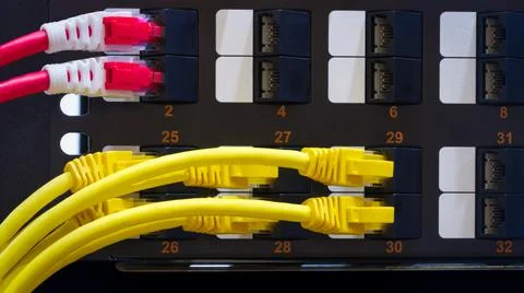 Multi Colored Network Cables Connected to Switch, network  technology concept Stock Photos