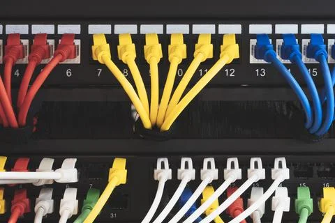 Multi Colored Network Cables Connected to Switch, network  technology concept Stock Photos