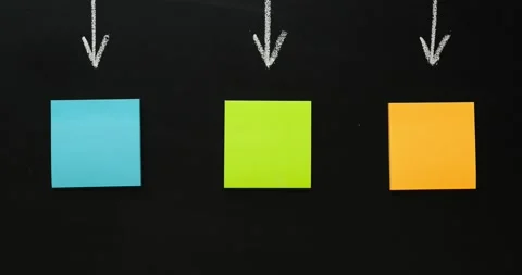 Multi-colored note paper with an arrows on a black background Stock Footage 226936276