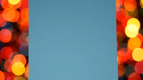 Multi colored notes paper on the flickering bokeh lights Stock Footage 99315382