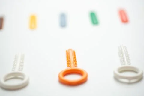 A multi-colored orthodontic ligatures for alignment of the orthodontist's tee Stock Photos