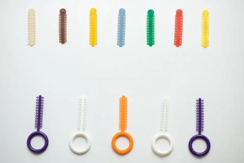 A multi-colored orthodontic ligatures for alignment of the orthodontist's tee Stock Photos