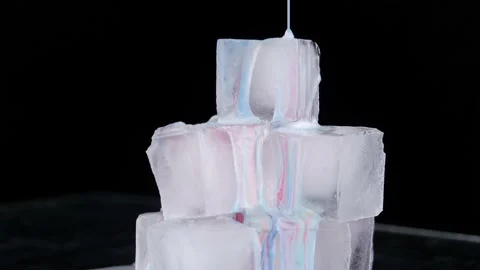 Multi-colored paint spreads over the sur... | Stock Video | Pond5