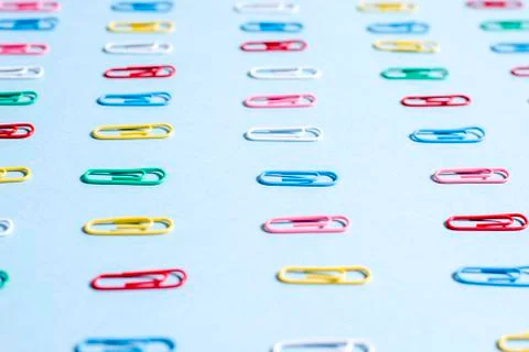 Multi-colored paper clips in row Stock Photos