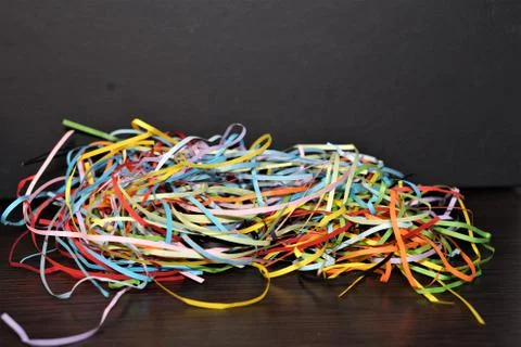 Multi-colored paper strip lines. Colorful paper filigree strips in waves on d Stock Photos