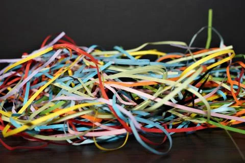 Multi-colored paper strip lines. Colorful paper filigree strips in waves on d Stock Photos