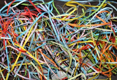 Multi-colored paper strip lines. Colorful paper filigree strips in waves on d Stock Photos