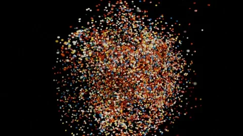 Multi colored particles fly after being exploded, colorful rainbow sprinkles Vídeos de archivo 106732921