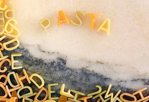 Multi Colored Pasta letters Stock Photos